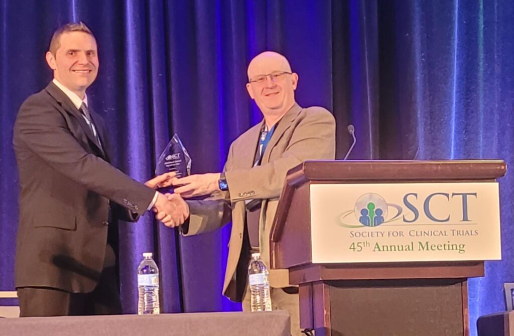 adam-devall-collecting-award.x974b1462